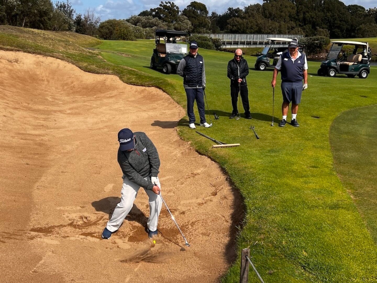 Hitting a golf ball out of a sand trap